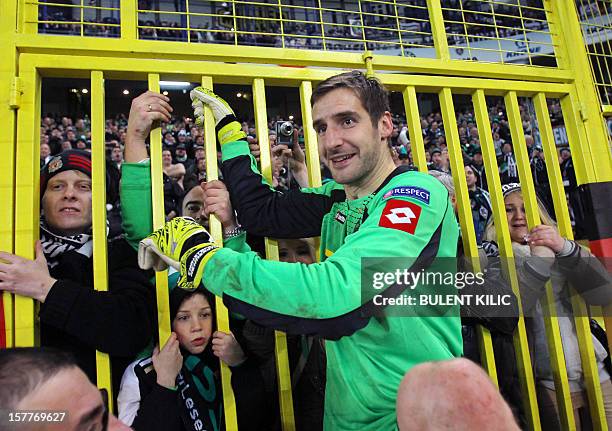 Borussia Monchengladbach's goalkeeper Christofer Heinmeroth celebrates with supporters after winning the UEFA Europa League football match against...