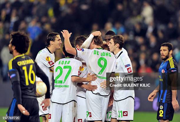 Borussia Monchengladbach's players celebrate after winning the UEFA Europa League football match against Fenerbahce SK on December 6, 2012 at Sukru...