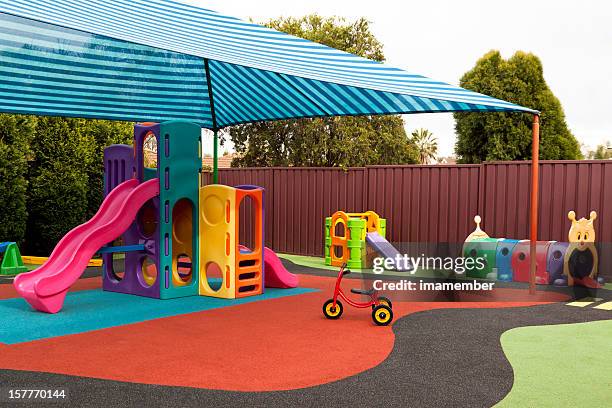 preschool playground with sunshade and playgraound equipment - playground stock pictures, royalty-free photos & images