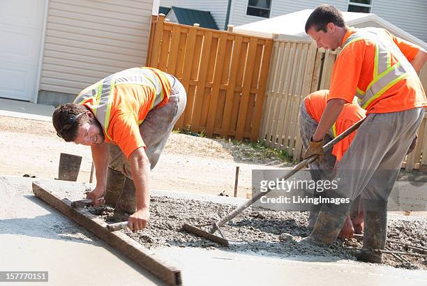 concrete crew - wet cement stock pictures, royalty-free photos & images