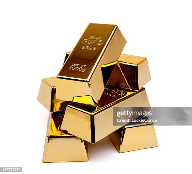 shiny gold ingots stacked upon each other - gold bullion stock pictures, royalty-free photos & images