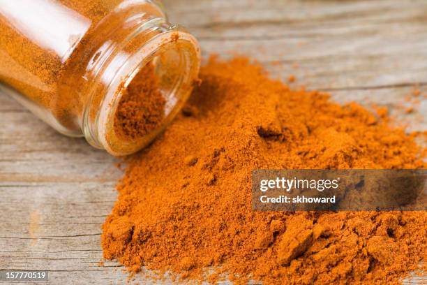 spilled cayenne pepper - red peppercorns stock pictures, royalty-free photos & images