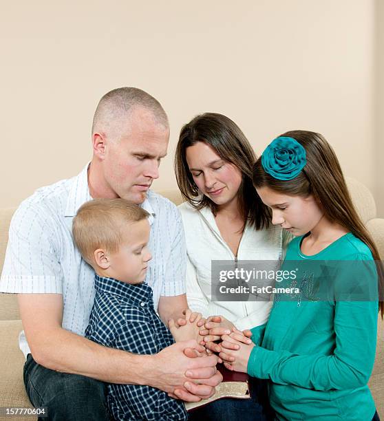 family prayer - family worship stock pictures, royalty-free photos & images