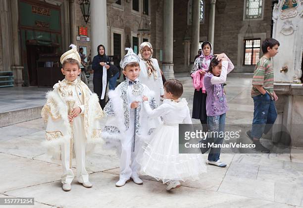 going to circumcision ceremony - boy circumcision stock pictures, royalty-free photos & images