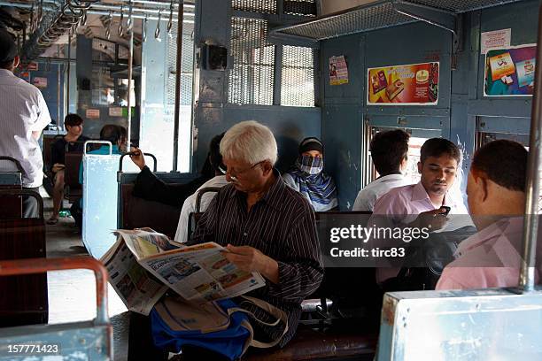 people travelling on local mumbai train - mumbai train stock pictures, royalty-free photos & images