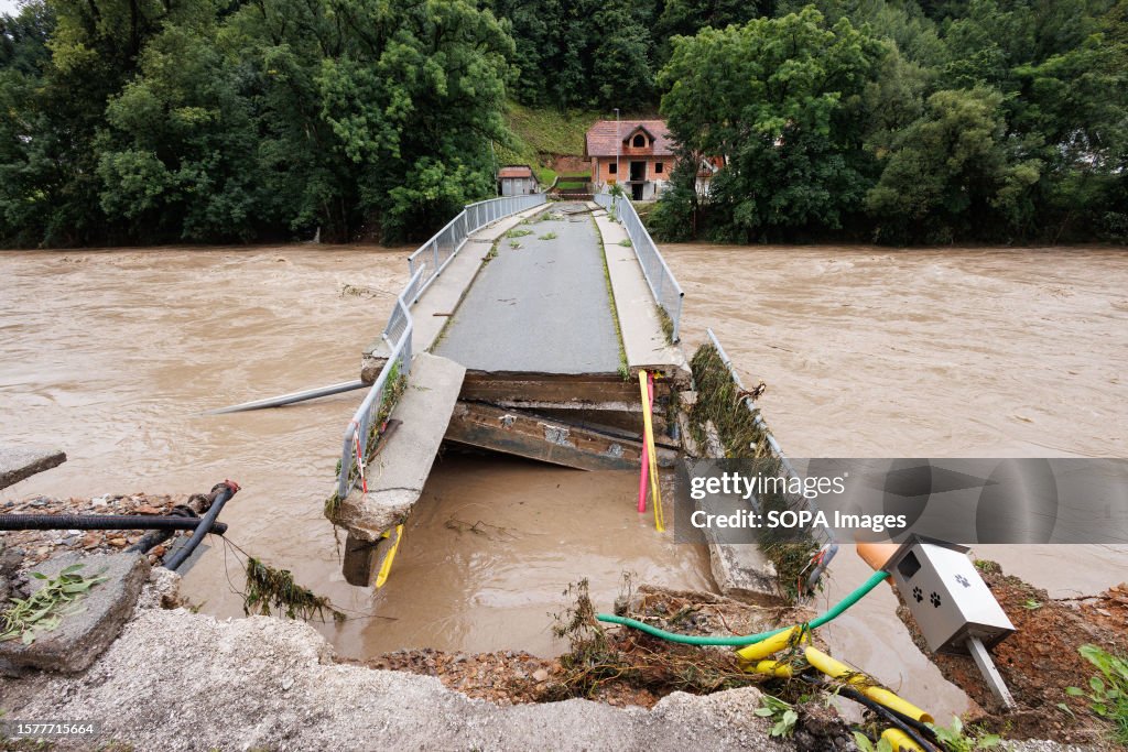 A broken bridge is seen in Suha near Skofja Loka after major...