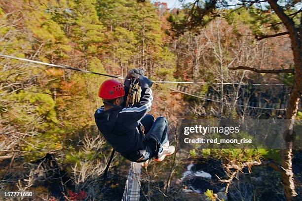 ziplining over carver's falls - facing things head on stock pictures, royalty-free photos & images