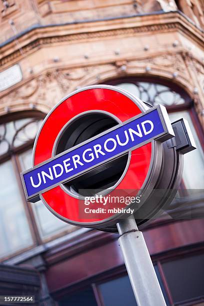 london underground famous sign in front of harrods department store - vertical chelsea london stock pictures, royalty-free photos & images