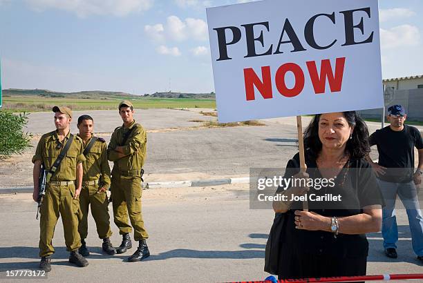 peace now protester at the erez crossing to the gaza strip - palestinian territories stock pictures, royalty-free photos & images