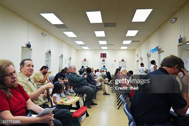 customers que in dmv waiting room - dmv photo stockfoto's en -beelden