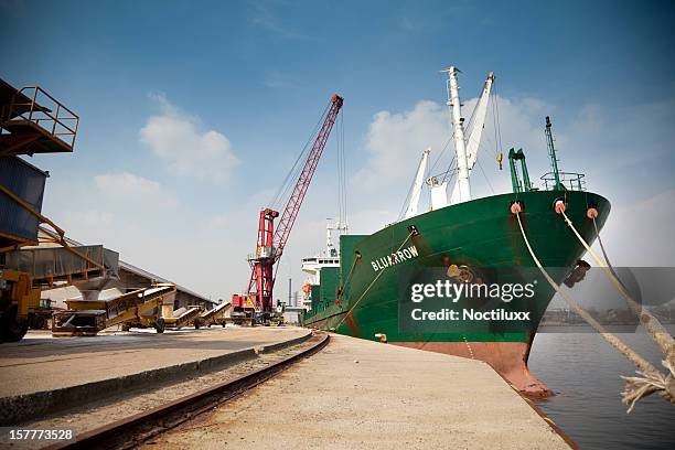 large cargo ship being loaded in port of ghent - gent stockfoto's en -beelden