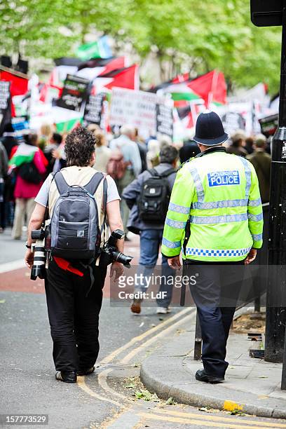 photographer and policeman - protest in gaza stock pictures, royalty-free photos & images