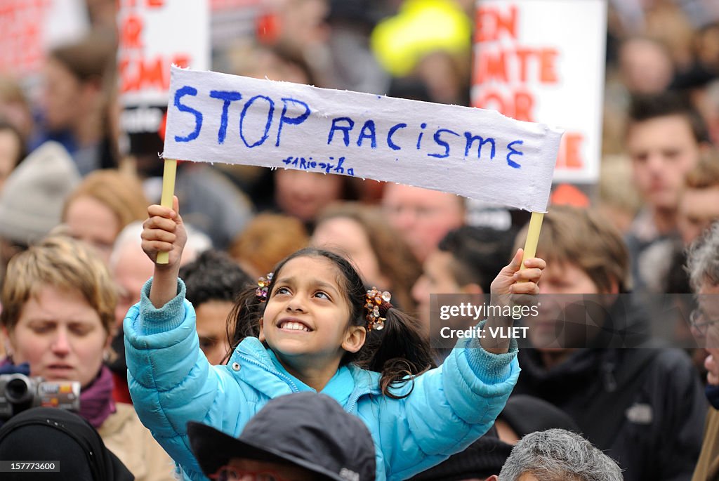 Girl holding a banner in an anti-racism protest