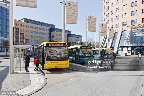 passengers at bus station downtown amersfoort, the netherlands - amersfoort netherlands stock pictures, royalty-free photos & images