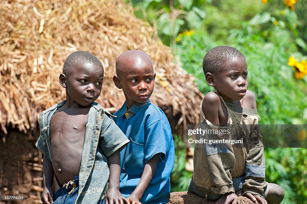 Group of young Pygmy children watching curious