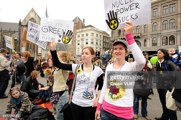 crowd protesting against nuclear energy, dam square, amsterdam - protest banner stock pictures, royalty-free photos & images
