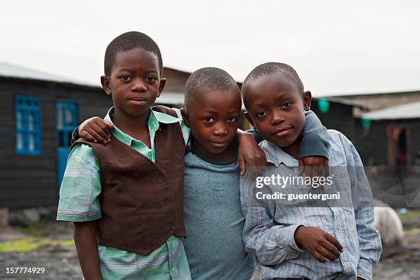 three african boys in the destroyed town of goma, congo - democratic republic of the congo stock pictures, royalty-free photos & images