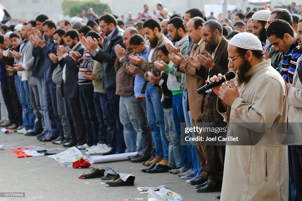 Muslim men praying together in Cairo's Tahrir Square