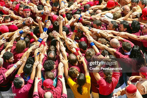 castellers: building a human castle - castell stock pictures, royalty-free photos & images