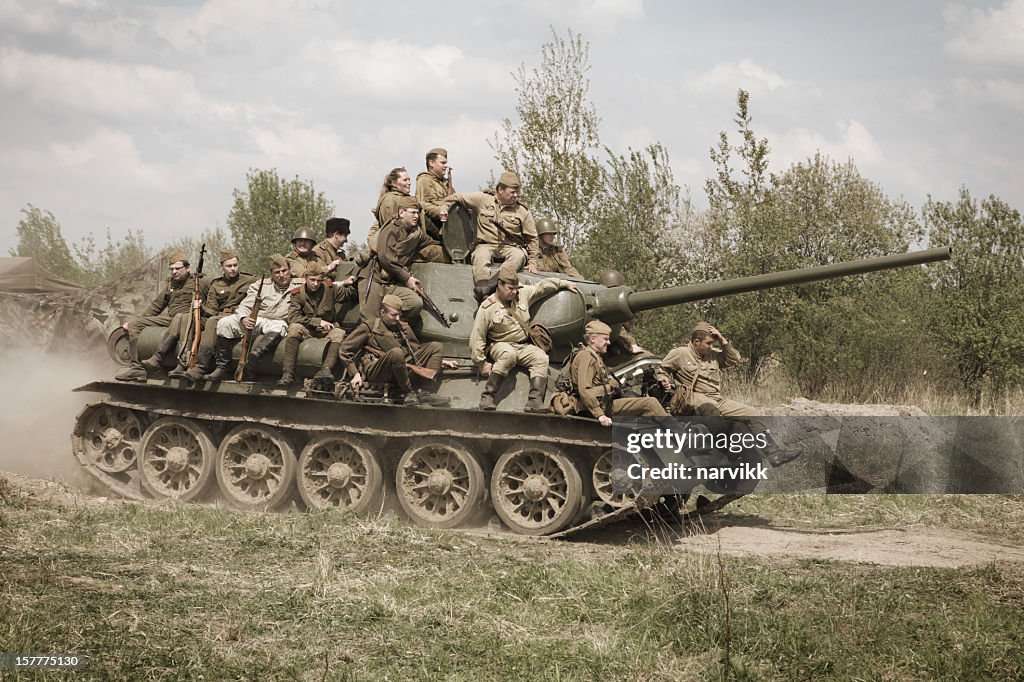 Soviet tank T-34 with group of Red Army soldiers