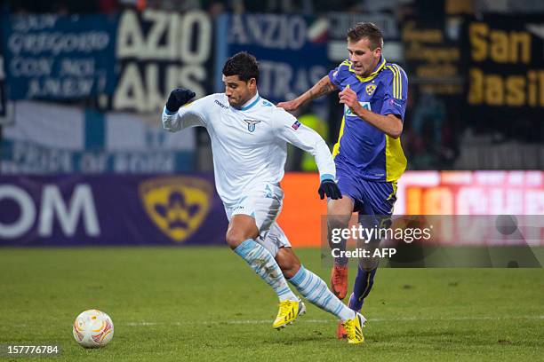 Lazio's Ederson vies with Maribor's Zeljko Filipovic during the UEFA Europa League football match NK Maribor vs S.S. Lazio in Maribor, on December 6,...