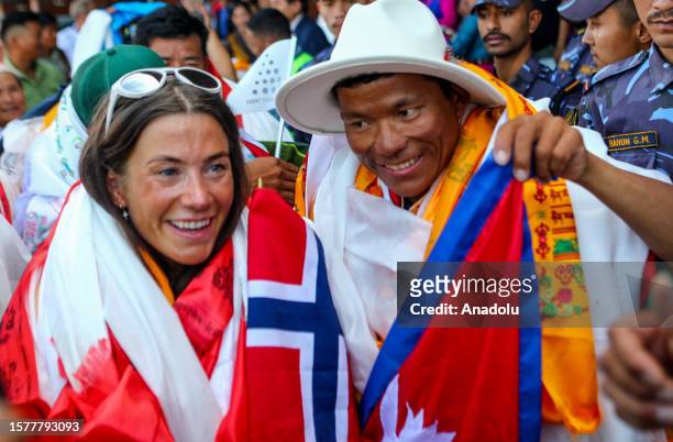 Norwegian mountaineer Kristin Harila Nepali mountaineer Tenjen Lama Sherpa gestures upon their arrival at the airport in Kathmandu, Nepal on August...