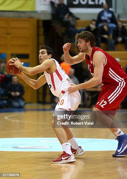 Kostas Sloukas, #10 of Olympiacos Piraeus competes with Luksa Andric, #12 of Cedevita Zagreb during the 2012-2013 Turkish Airlines Euroleague Regular...