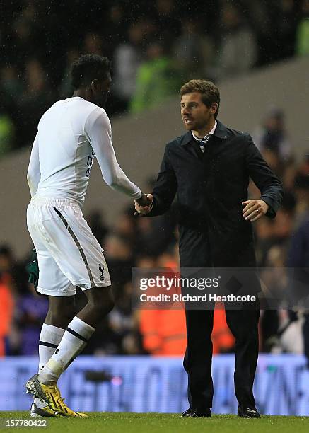 Head Coach Andre Villa Boas of Tottenham Hotspur shales hands with Emmanuel Adebayor of Tottenham Hotspur at the final whistle during the UEFA Europa...