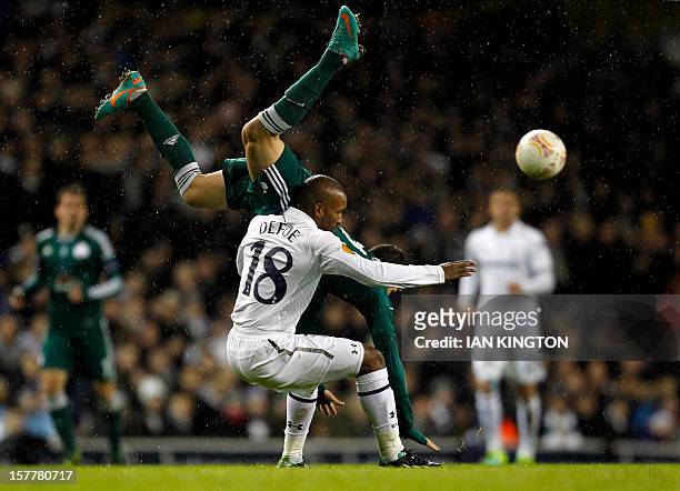 Tottenham Hotspur's English striker Jermain Defoe tustles with Panathinaikos's Greek defender Konstantinos Triantafyllopoulos during the UEFA Europa...