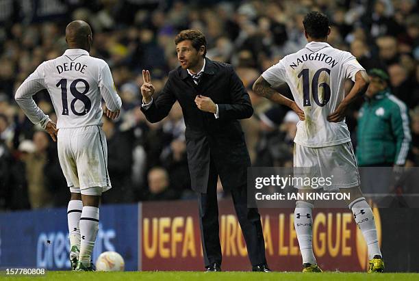 Tottenham Hotspur's Portuguese manager Andre Villas-Boas talks to Tottenham Hotspur's English striker Jermain Defoe during the UEFA Europa League...