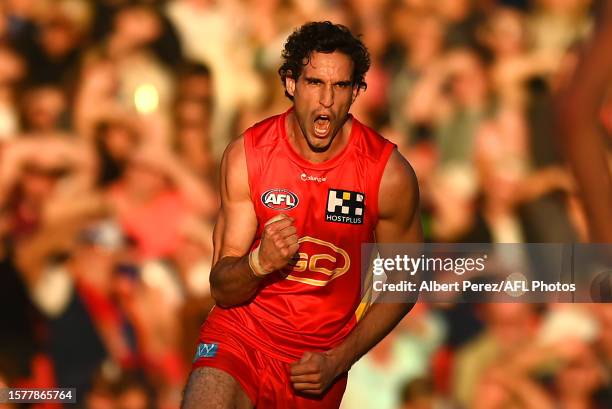 Ben King of the Suns celebrates kicking a goal during the round 20 AFL match between Gold Coast Suns and Brisbane Lions at Heritage Bank Stadium, on...