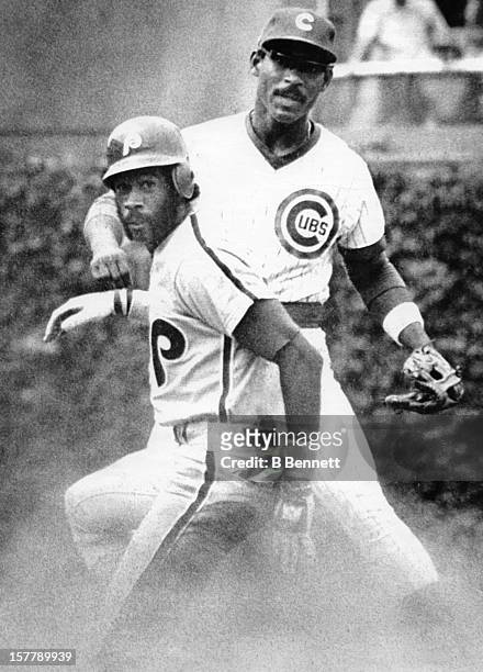 Ivan DeJesus of the Chicago Cubs watches his relay throw to first as Garry Maddox of the Philadelphia Phillies is forced out at second base on June...