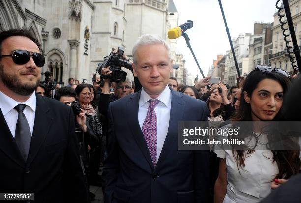 Wikileaks Founder Julian Assange, C, Leaves Britain's Royal Courts Of Justice with lawyer Amal Alamuddin After His Extradition Appeal Was Heard In...