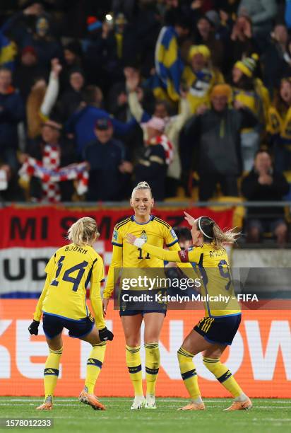 Stina Blackstenius of Sweden celebrates with teammates Nathalie Bjorn and Kosovare Asllani after scoring her team's third goal during the FIFA...