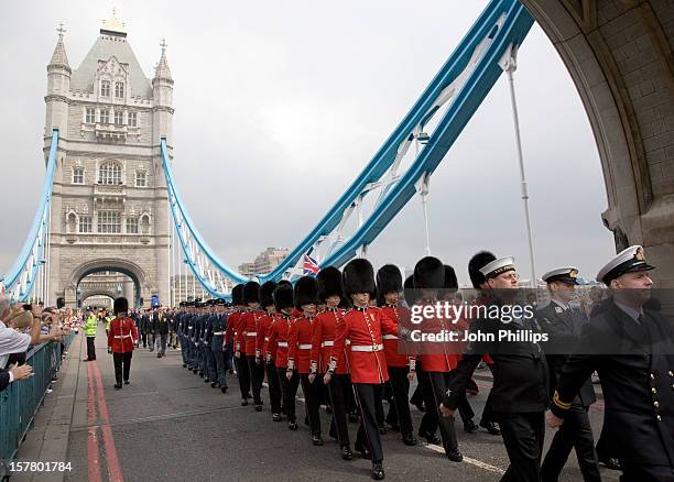 Military Verterans March Across Tower Bridge To Mark Armed Forces Day, In London.