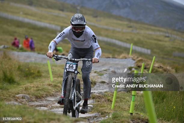 Germany's Thore Hemmerling competes in the men's elite mountain bike downhill final at the Nevis Range Mountain Resort, near Fort William in the...
