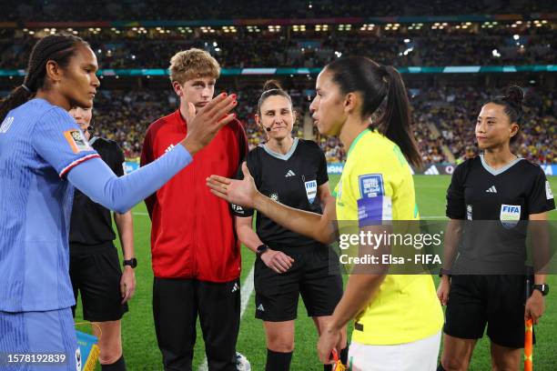Captains Wendie Renard of France and Rafaelle of Brazil shake hands at the coin toss prior to the FIFA Women's World Cup Australia & New Zealand 2023...