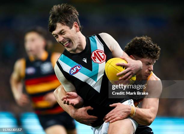 Zak Butters of Port Adelaide tackled by a26during the round 20 AFL match between Adelaide Crows and Port Adelaide Power at Adelaide Oval, on July 29...