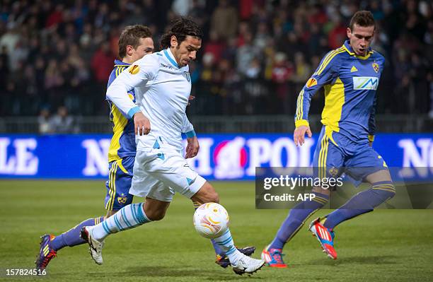 Sergio Floccari of Lazio vies for the ball with Maribor's defenders during their UEFA Europa League football match NK Maribor vs. S.S. Lazio in...