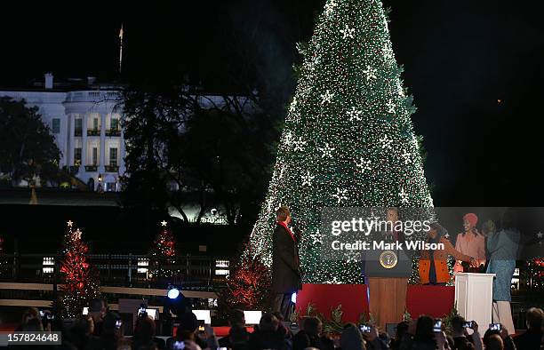 President Barack Obama, Sasha and Malia Obama and First Lady Michelle Obama , stand with Actor Neil Patrick Harris after the National Christmas tree...