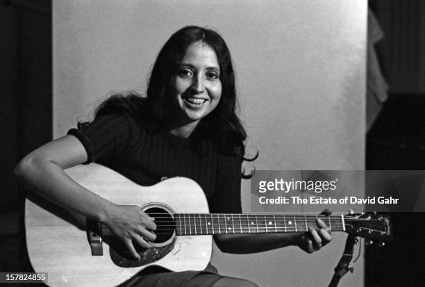 Singer and musician Maria Muldaur poses for a portrait with a guitar during a recording session at the Vanguard Records studios on March 2, 1966 in...