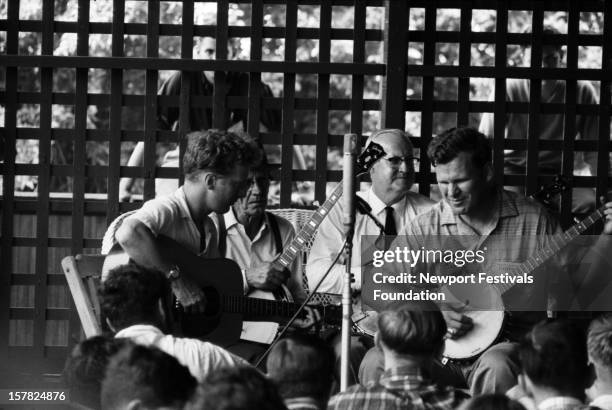 Traditional and old-timey musicians John Cohen, Clarence Ashley, Dock Boggs, and Doc Watson perform at the Newport Folk Festival in July, 1963 in...