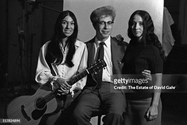 From l-r: singer songwriter Buffy Sainte-Marie, Vanguard Records founder Maynard Solomon, and singer and musician Maria Muldaur pose for a portrait...