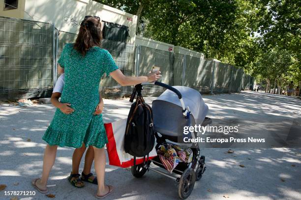 Person with a baby carriage in El Retiro park, on 29 July, 2023 in Madrid, Spain. Ayuso's executive has approved this week, in the Governing Council,...