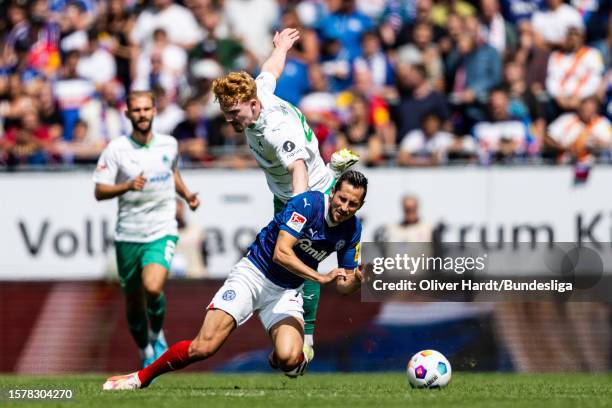 Steven Skrzybski of Holstein Kiel competes for the ball with runs off the ball ert Wagner of SpVgg Greuther Fürth during the Second Bundesliga match...