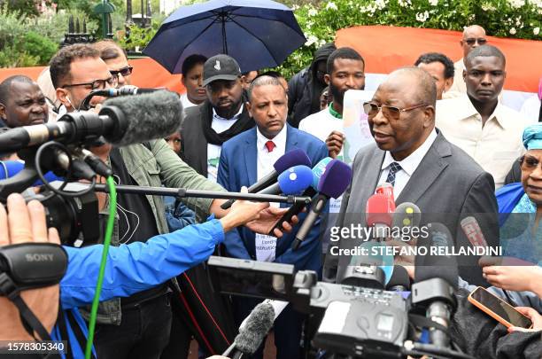 Niger Prime Minister Ouhoumoudou Mahamadou speaks with the press outside the Niger Embassy, in Paris on August 5 days after coup plotters ousted...