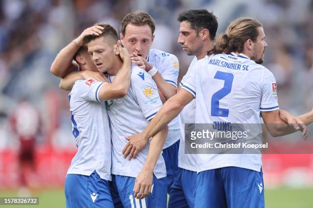 Marvin Wanitzek of Karlsruhe celebrates the second goal with Paul Nebel of Karlsruhe , Robin Bormuth and Lars Stindl of Karlsruhe and Sebastian Jung...