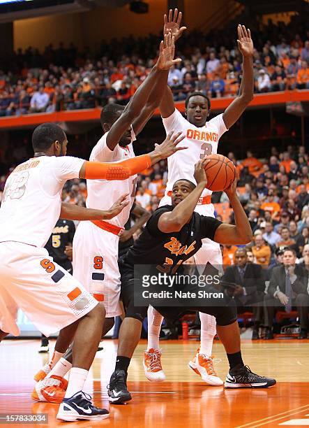 Kyle Richardson of the Long Beach State 49ers drives to the basket against Baye Moussa Keita, James Southerland and Jerami Grant of the Syracuse...