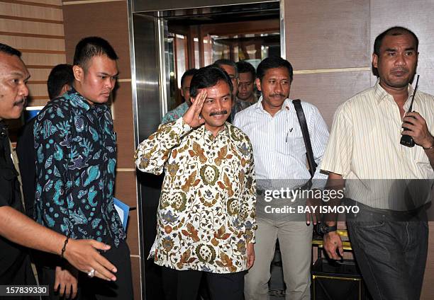 Sport Minister Andi Mallarangeng gestures before a press conference in Jakarta on December 7, 2012 to announce his resignation and becomes the first...
