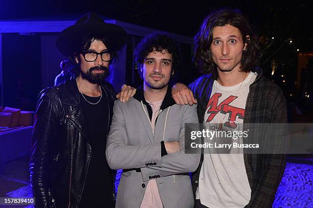 Miles Hendrix with musicians Nick Valensi and Fabrizio Moretti of The Strokes attend the Carrera Cocktail Party hosted by AD Oasis at The Raleigh on...